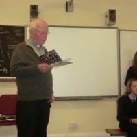 Fr. Crawford gives a blessing to the Pupils of 6th Class at their Graduation.