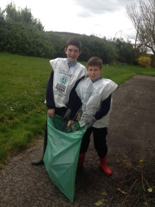 Darragh and Kuba collecting some sticks after the bad storms.